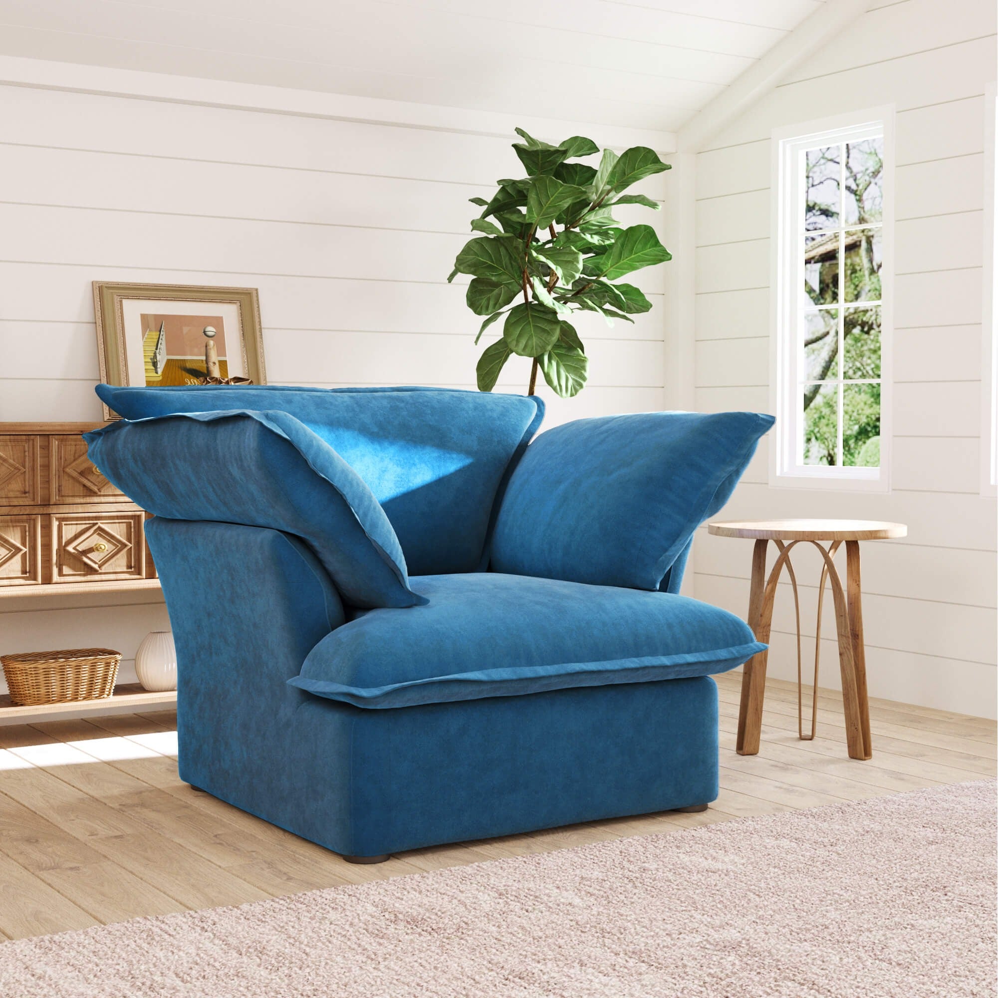 Sky blue armchair in a room with a plant and window