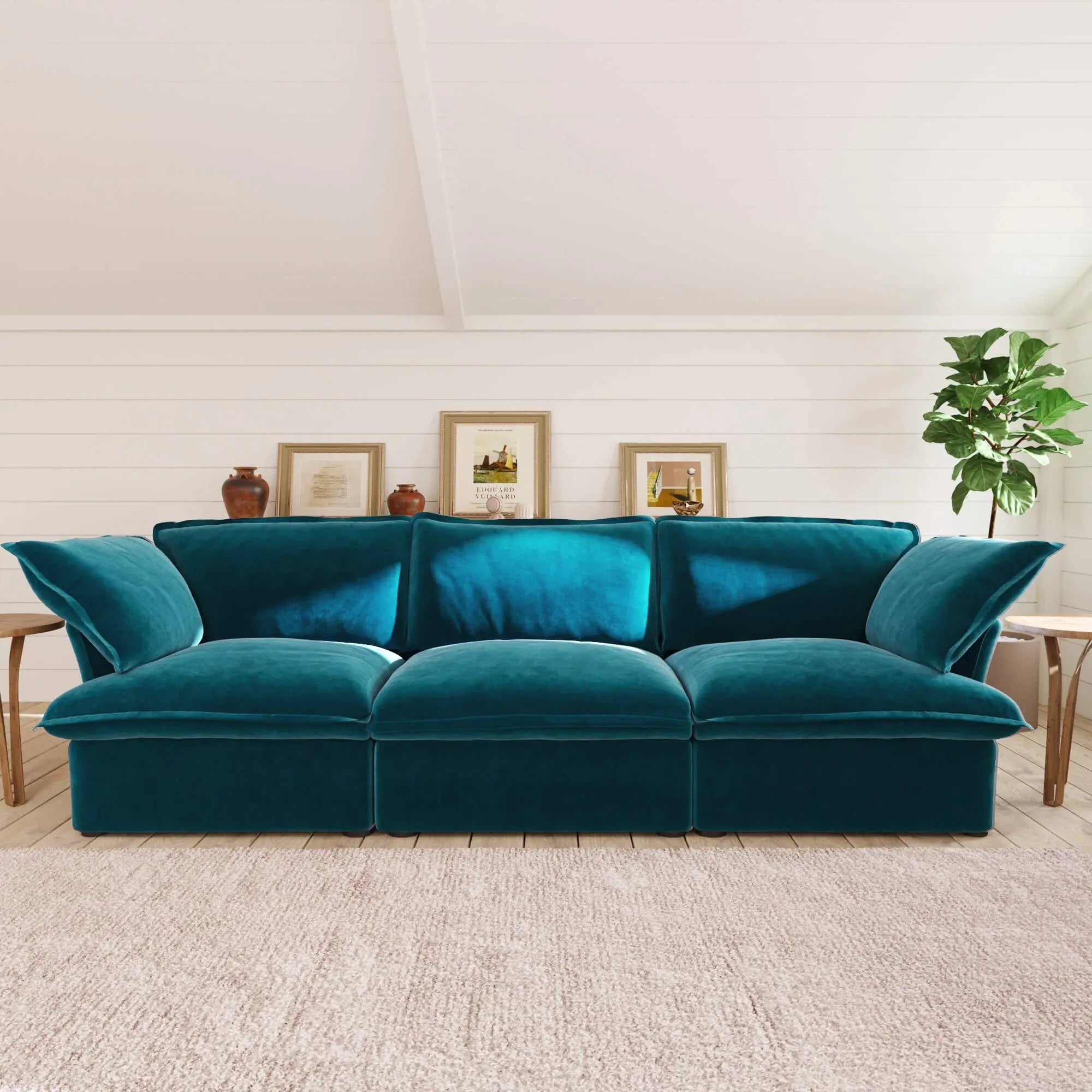 Teal sofa in a living room with decorative elements.
