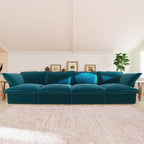 Turquoise 4-seat sectional sofa in a room with wooden floor and white walls