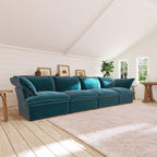 Teal 4-seat sectional sofa in a room with wooden floor and white walls