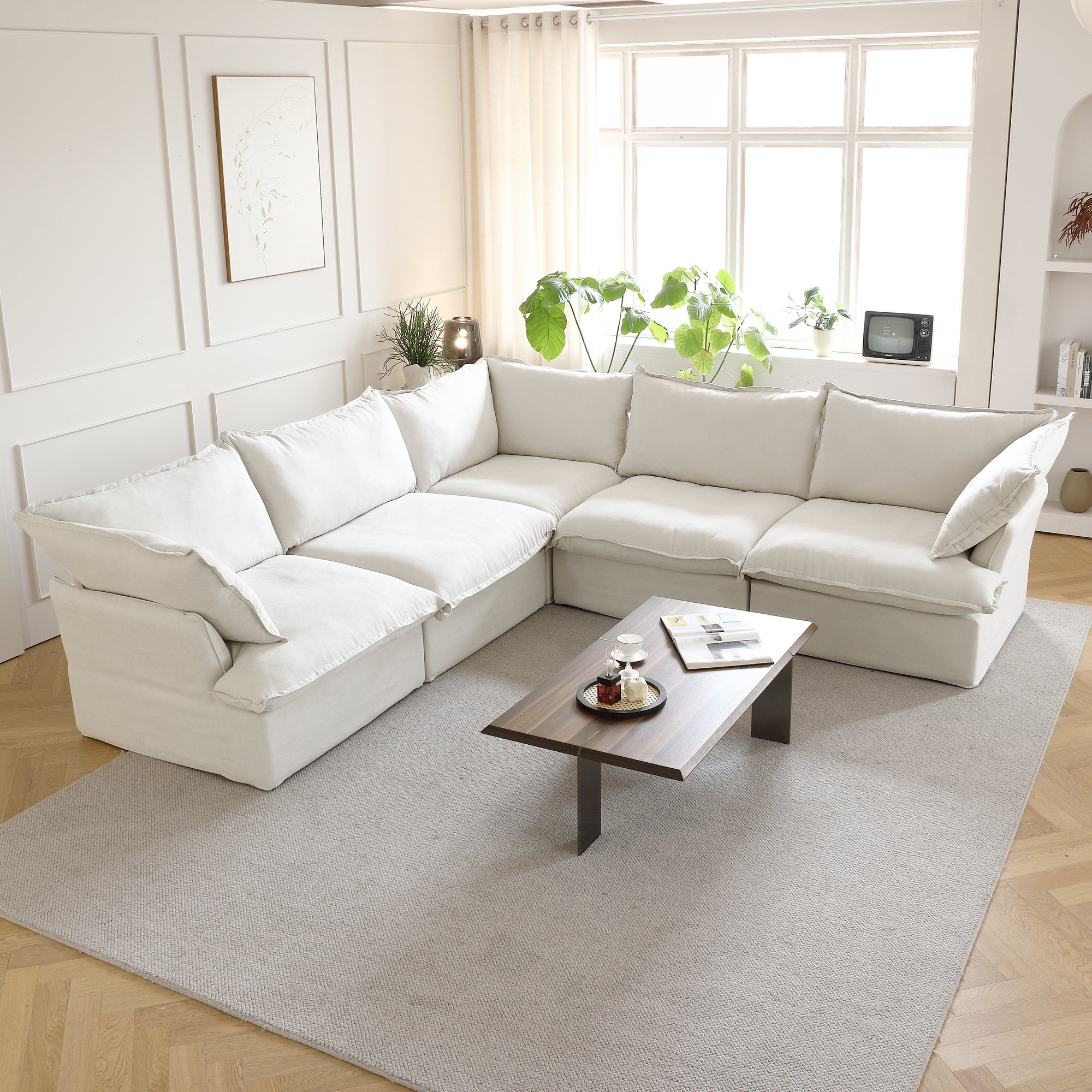 big white linen corner sectional couch in the living room, l shaped
