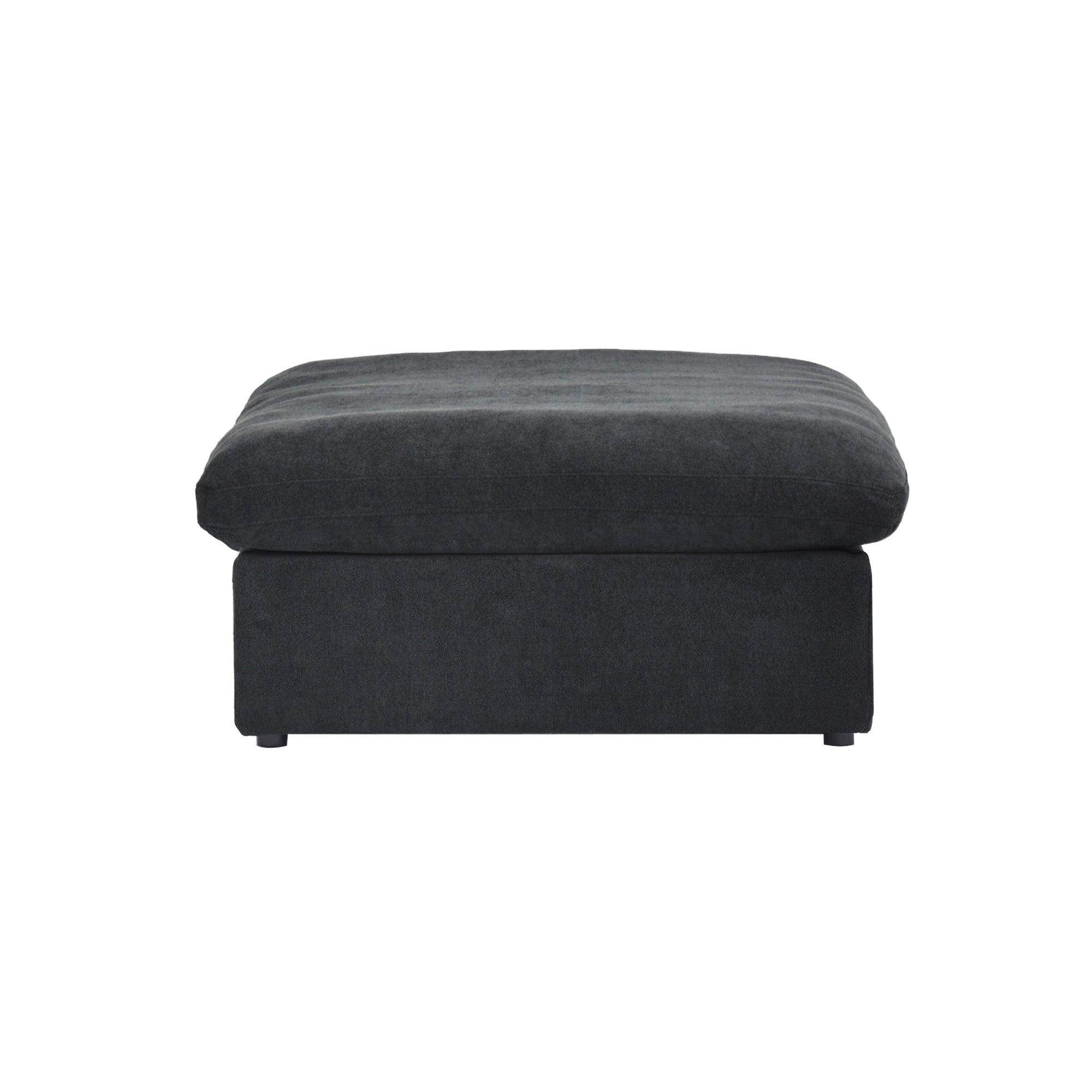 Black ottoman with a hidden storage on a white background