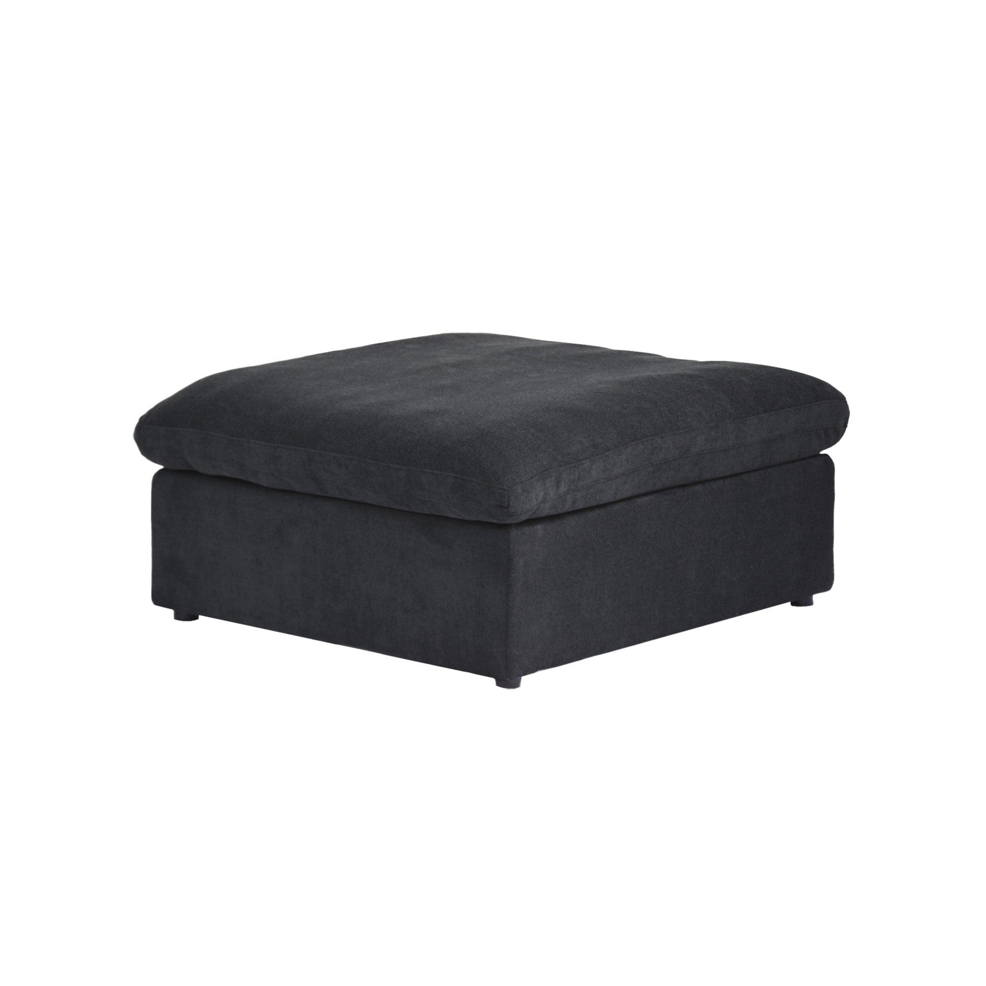 Black ottoman with a hidden storage on a white background