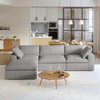 A gray L-shaped modular sectional sofa with a storage ottoman in a modern living room setting.