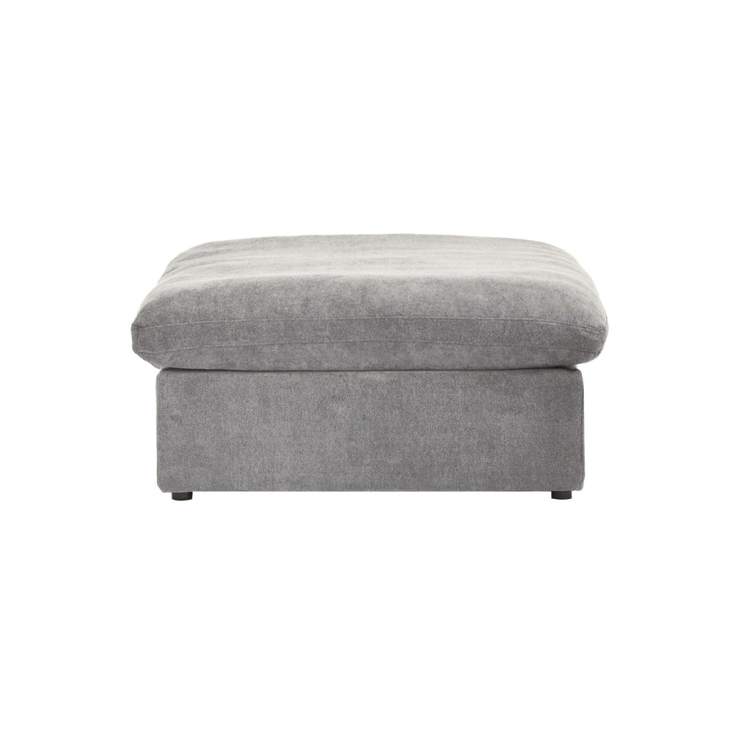 A gray linen upholstered ottoman with a cushioned top.