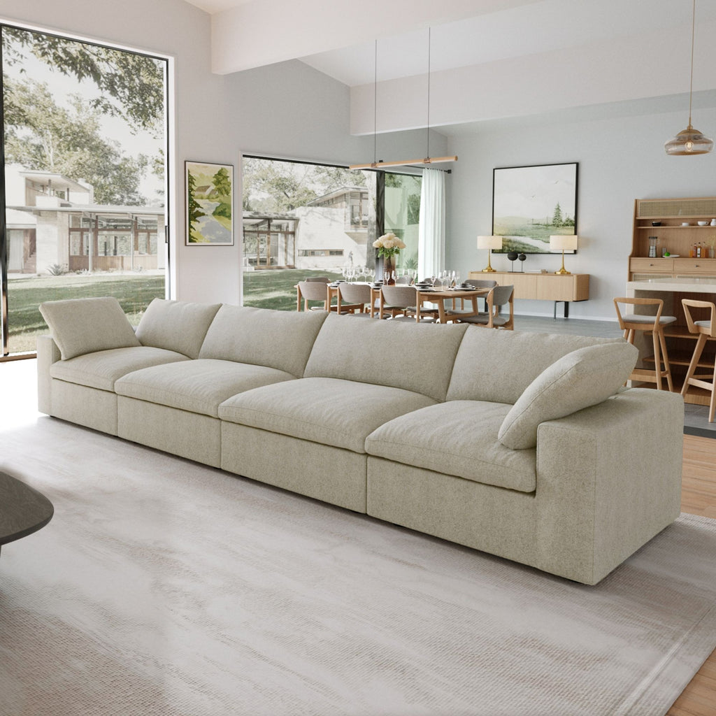 Khaki 4-seat sectional sofa in a modern living room with large windows and a dining area.