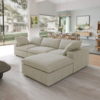 Khaki L-shaped sectional sofa with a storage ottoman in a modern living room with large windows and a dining area.