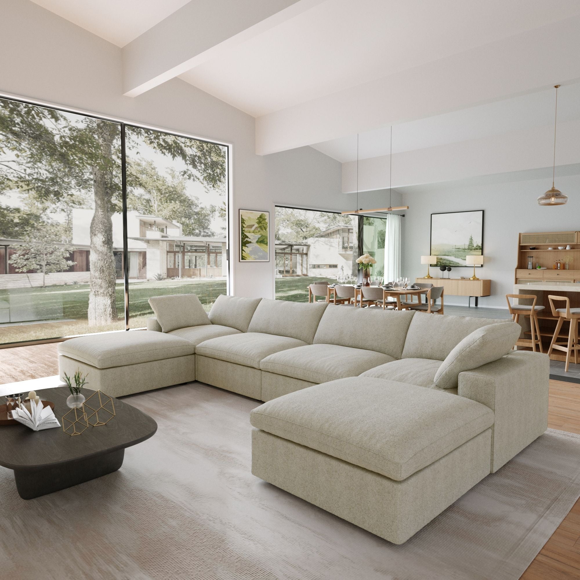 Modern living room with a khaki U-shaped sectional sofa, coffee table, and large windows.
