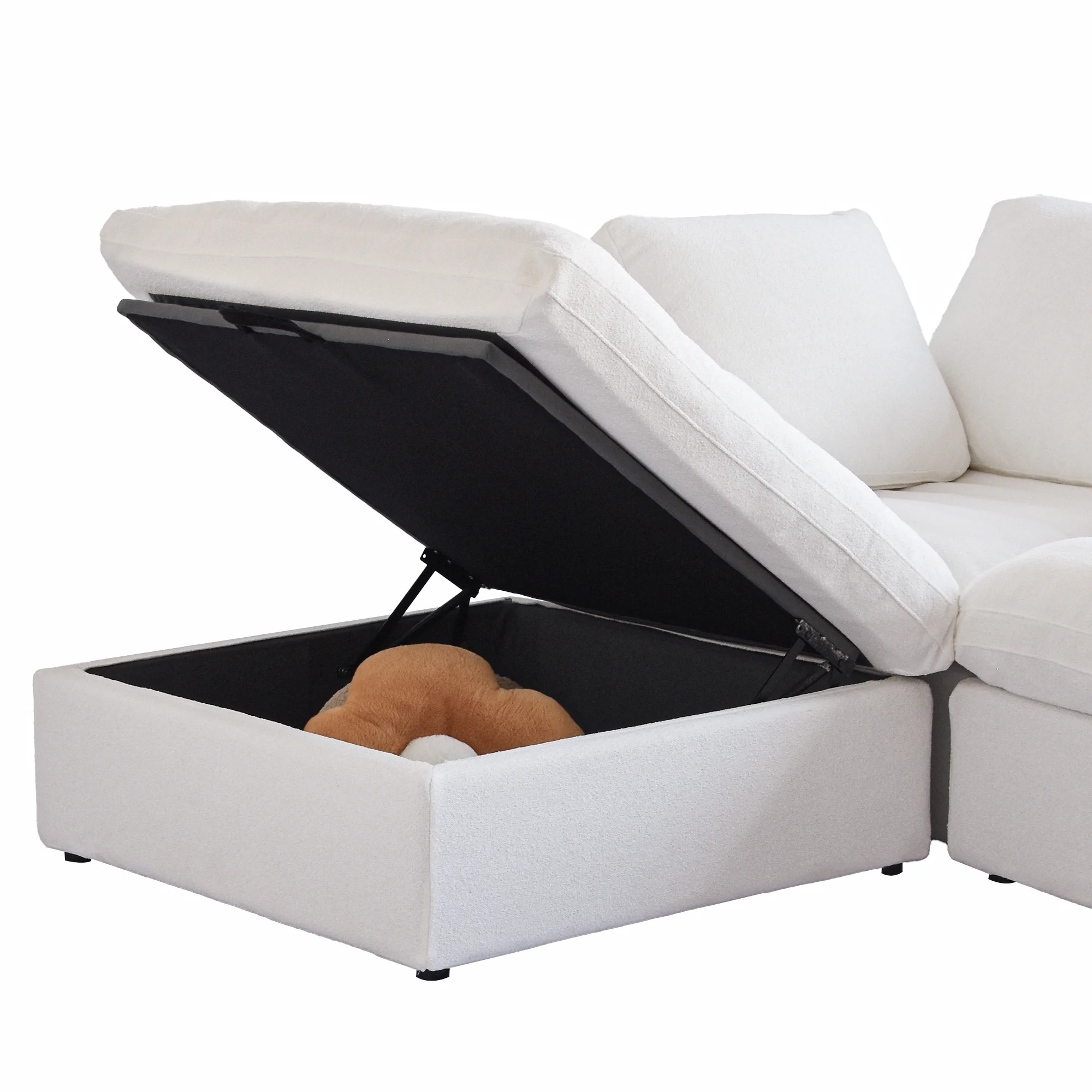 White sectional sofa with storage compartment open on a white background