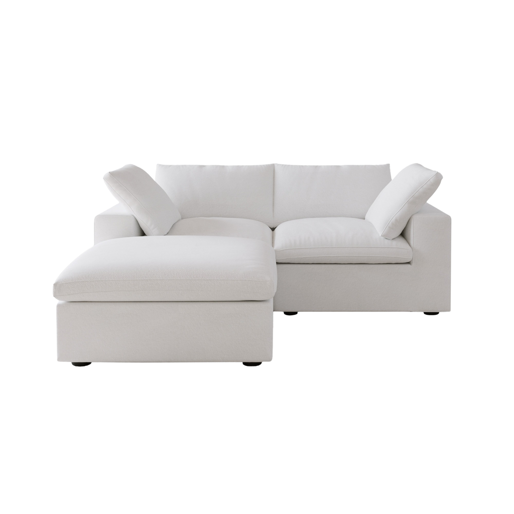 White loveseat sectional sofa with chaise on a white background