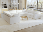 A modern, modular pit-style 8-seat sectional sofa in white in a living room setting with white cushions and a clean, contemporary design.