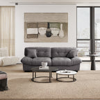 An 89-inch gray microfiber suede sofa in a cold lightning with a solid hardwood frame, presented in a living room setting with minimalistic decor.