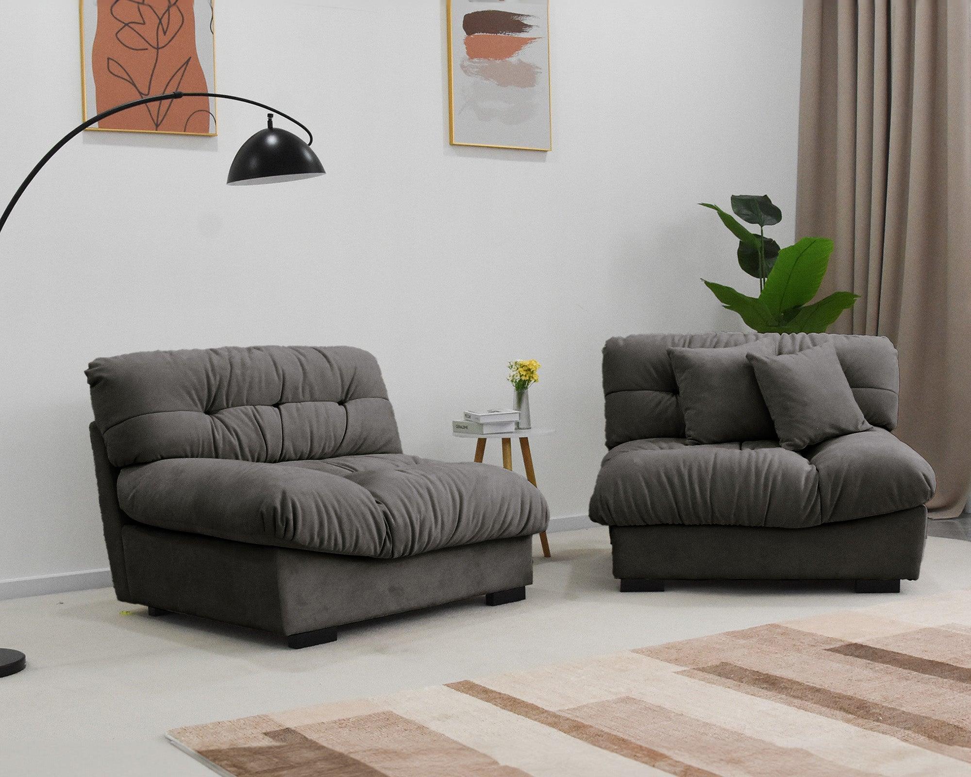 Black suede sofa split in two in a modern living room with minimalistic decor.