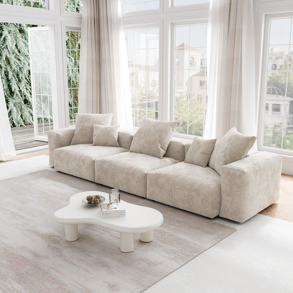 A beige corduroy sectional 3-seat sofa with detachable armrests and removable covers, pet-friendly, displayed in a bright living space.