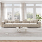 A beige corduroy 4-seat sectional modular sofa with detachable armrests and removable covers, designed to seat four people, displayed in a bright room with large windows.