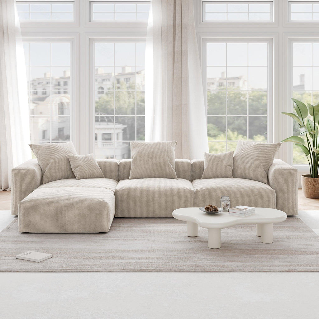 A beige L-shaped corduroy modular sofa with detachable armrests and removable covers, pet-friendly, displayed in a bright living space.