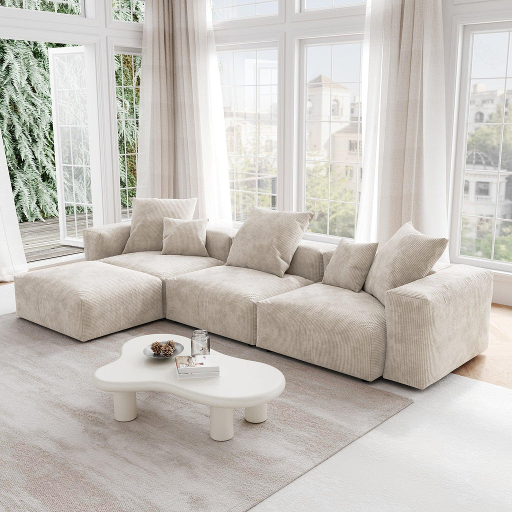 A beige L-shaped corduroy modular sofa with detachable armrests and removable covers, pet-friendly, displayed in a bright living space.