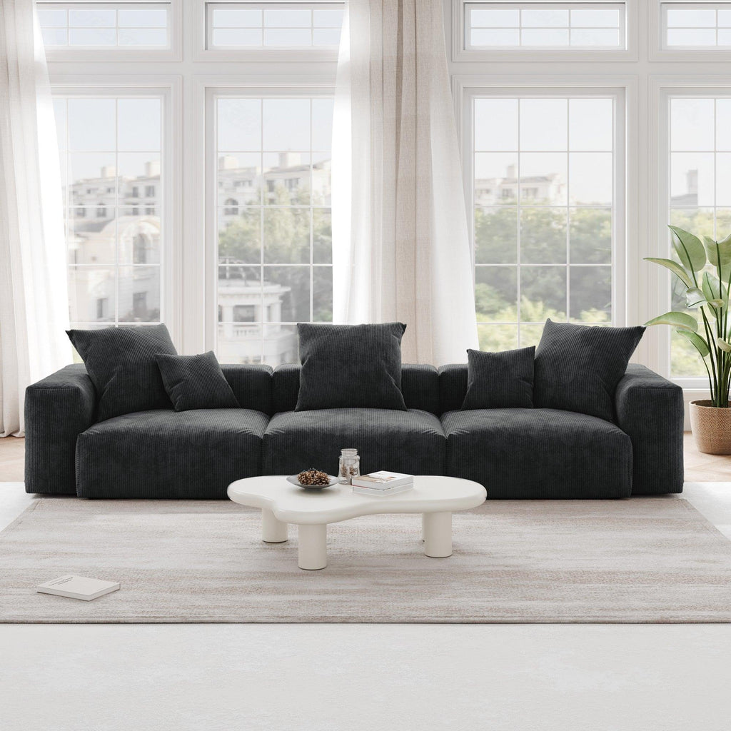 A black corduroy 3-seat sectional modular sofa with detachable armrests and removable covers, pet-friendly, displayed in a bright living space.