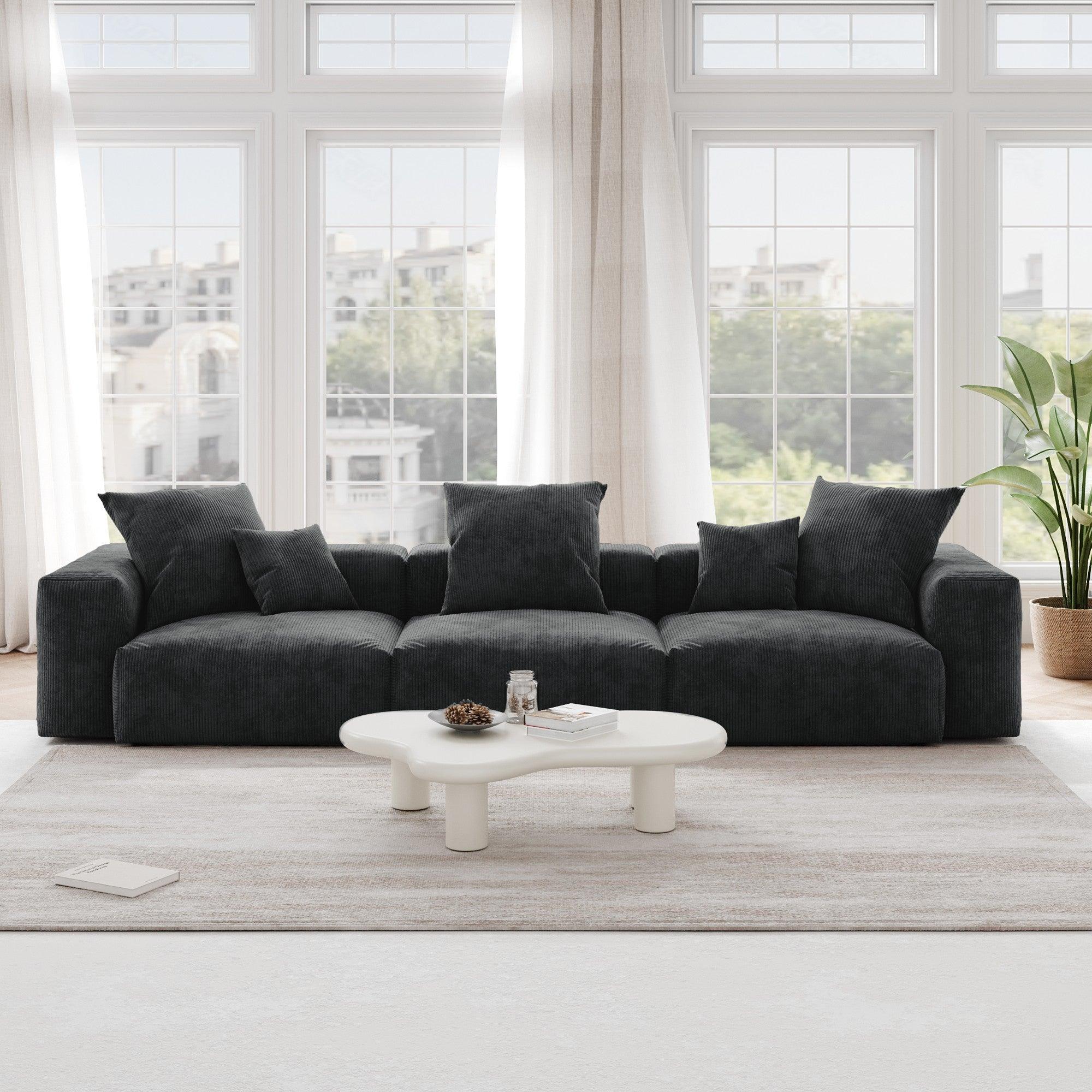 A black corduroy 3-seat sectional modular sofa with detachable armrests and removable covers, pet-friendly, displayed in a bright living space.