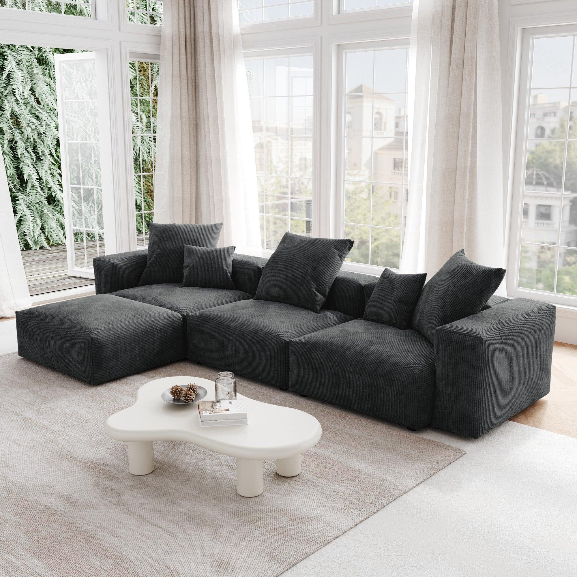 A black L-shaped corduroy modular sofa with detachable armrests and removable covers, pet-friendly, displayed in a bright living space.