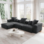 A black corduroy 3-seater L-sectional with replaceable covers.