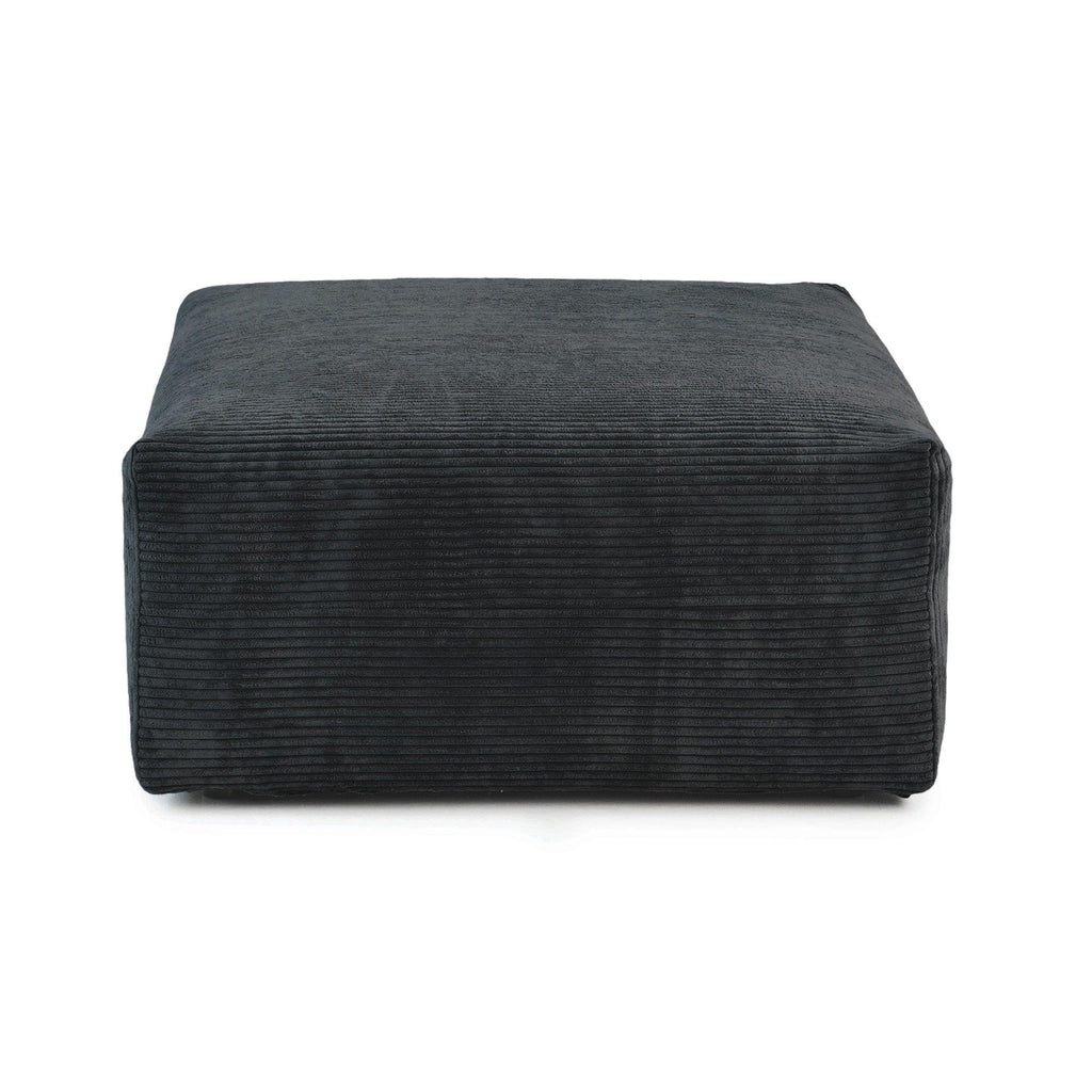 A black corduroy modular ottoman with removable covers, presented in a minimalist style against a white background.