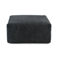 A black corduroy modular ottoman with removable covers, presented in a minimalist style against a white background.