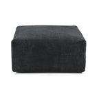 A black corduroy modular ottoman with removable covers, presented in a minimalist style against a white background.