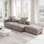 A brown corduroy 3-seat sectional lounger sofa with detachable armrests and removable covers, positioned in a bright room with large windows.