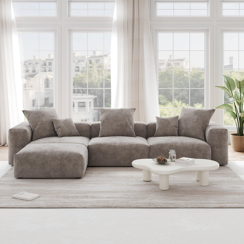 A brown L-shaped corduroy modular sofa with detachable armrests and removable covers, pet-friendly, displayed in a bright living space.