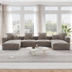 A brown corduroy modular sectional sofa with detachable armrests and removable covers, arranged in a U-shape configuration in a room with a light interior.