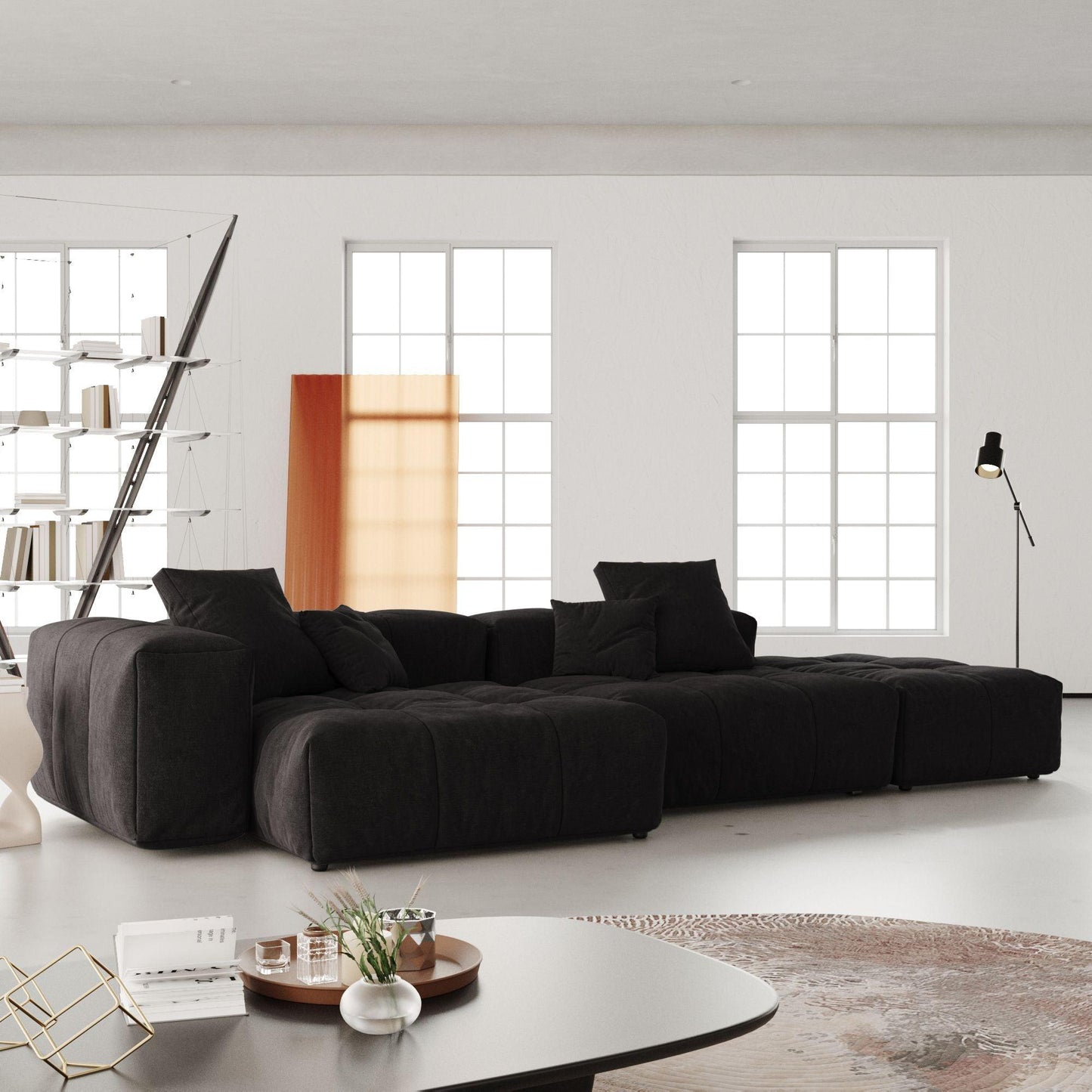 A modern, black 3-seat modular lounger sofa in a bright room, featuring a linen white upholstery with wide armrests and high-density foam cushions.