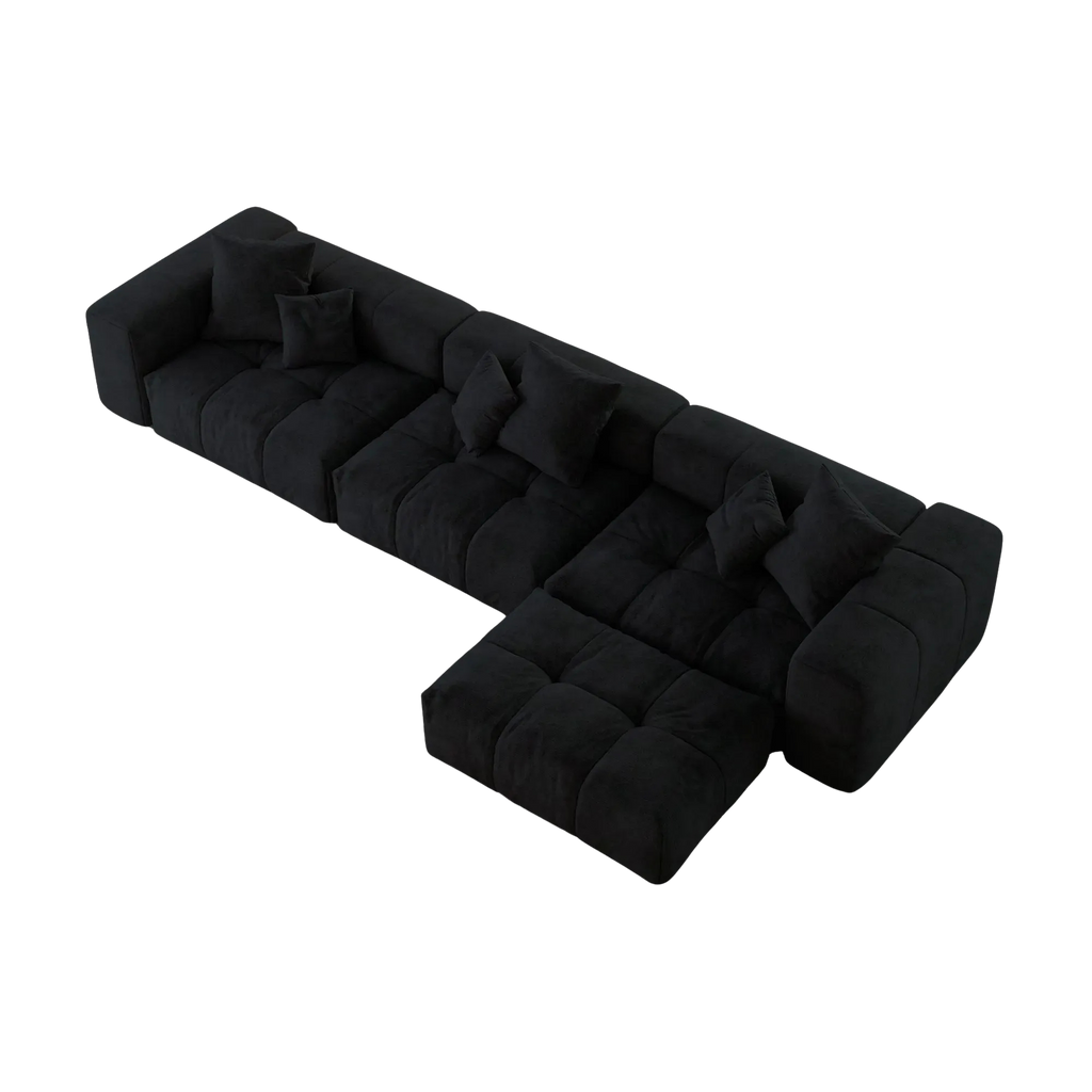 Black L-shaped sofa with a unique design on a white background