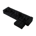 Black L-shaped sofa with a unique design on a white background