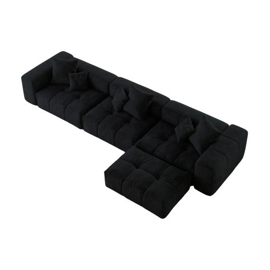 Black L-shaped sofa with a unique design on a white background