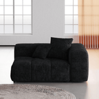 Black linen armrest left chair in a modern living room with large windows.