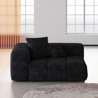 Black linen armrest module with cushions in a modern living room setting.
