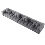 Gray 4-seat sectional sofa with multiple cushions on a white background