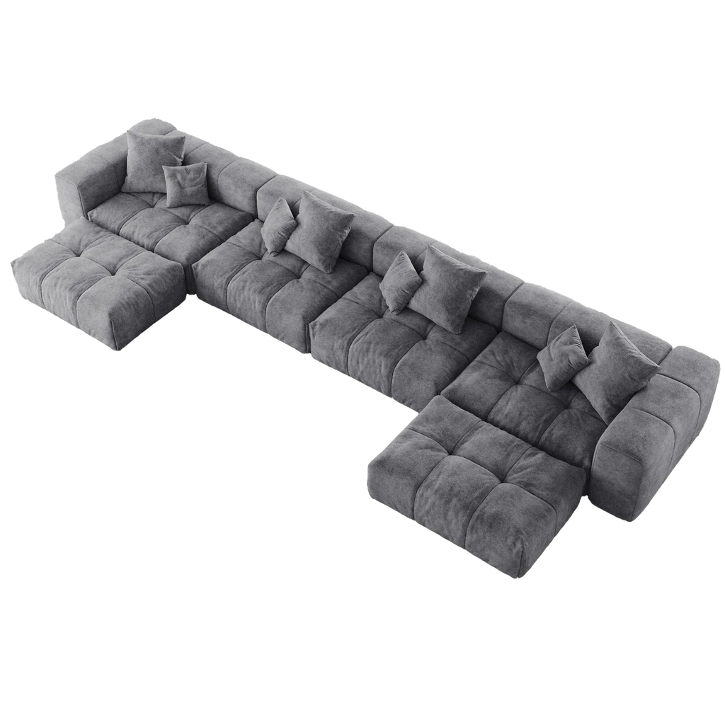 Gray U-shaped sectional sofa with cushions on a white background