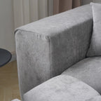Gray upholstered corner sofa with a neutral background