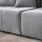 Gray sectional sofa on a carpeted floor