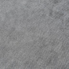 Close-up of gray linen fabric of a sofa