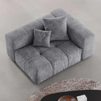 Gray left armrest chair with cushions on a light gray floor