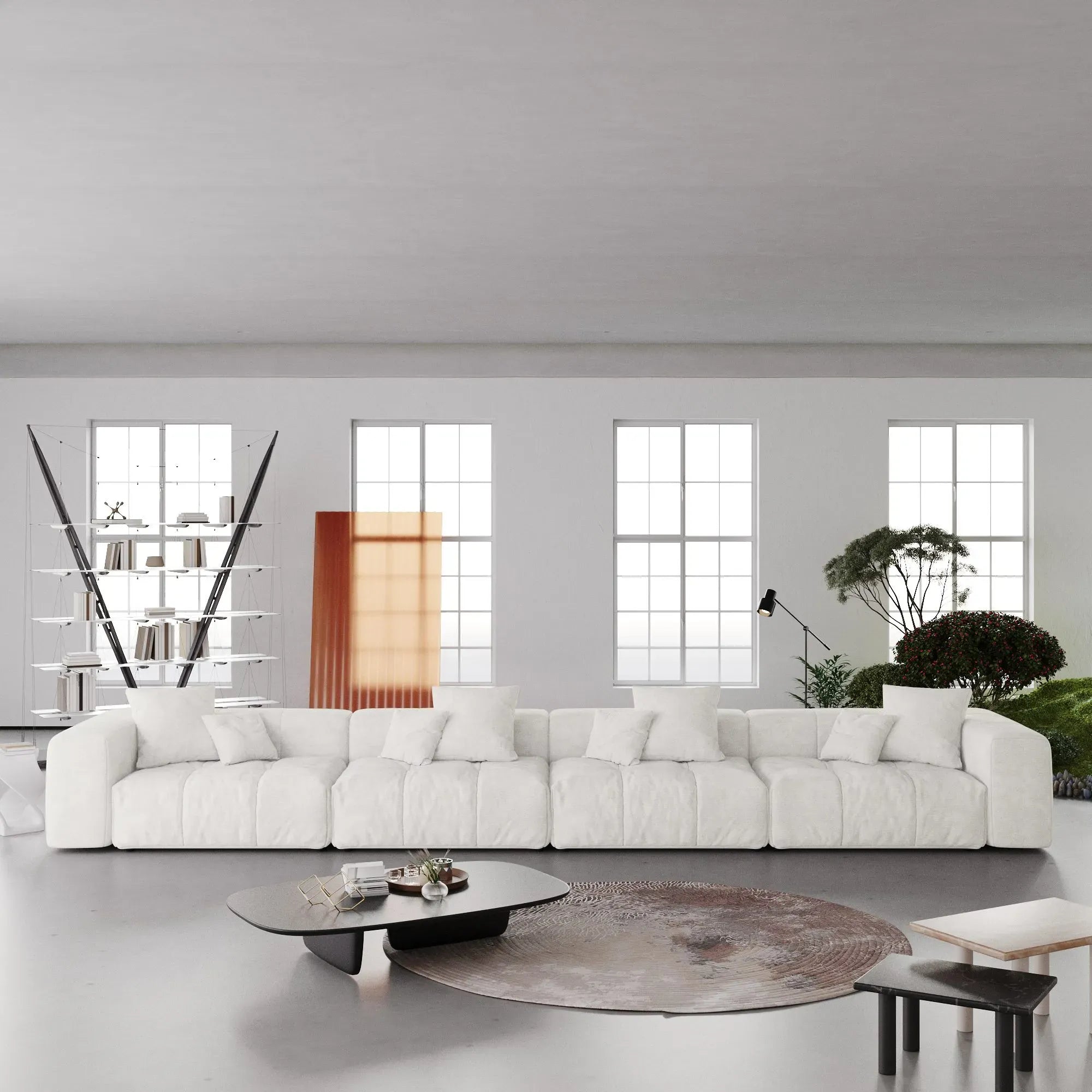 Modern white 4-seater sofa in a minimalistic living room with large windows.