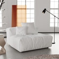 White armless module for sofa with cushions in a modern living room setting