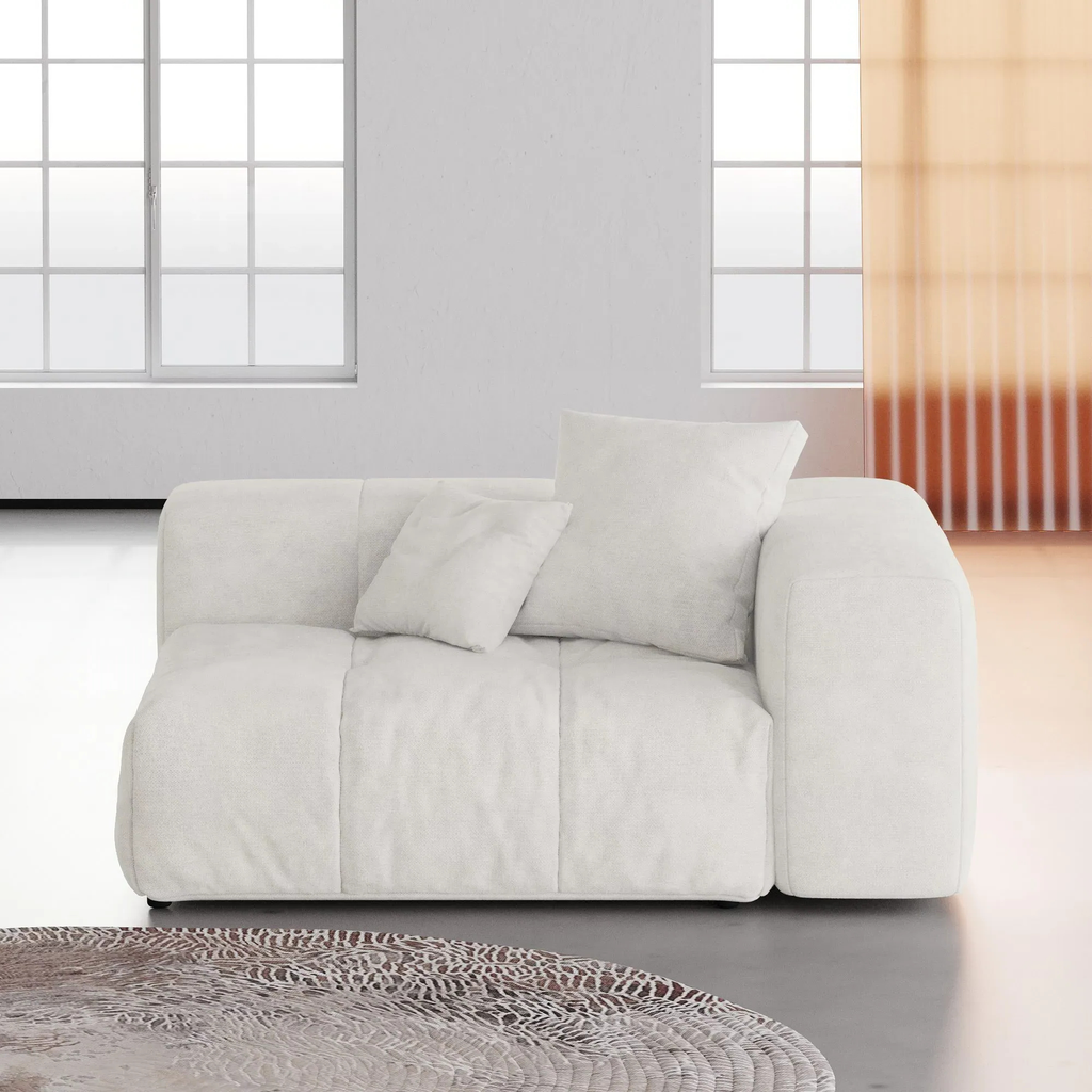 White left armrest chair in a modern room with large windows