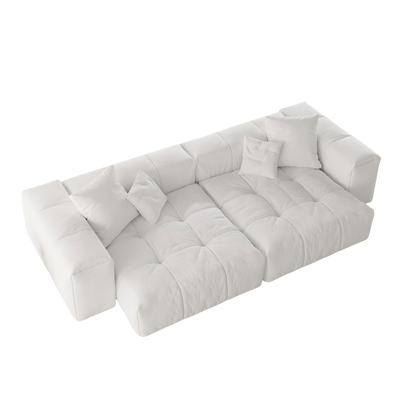 White loveseat sofa with tufted design on a white background