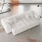 White sectional loveseat sofa in a modern living room setting