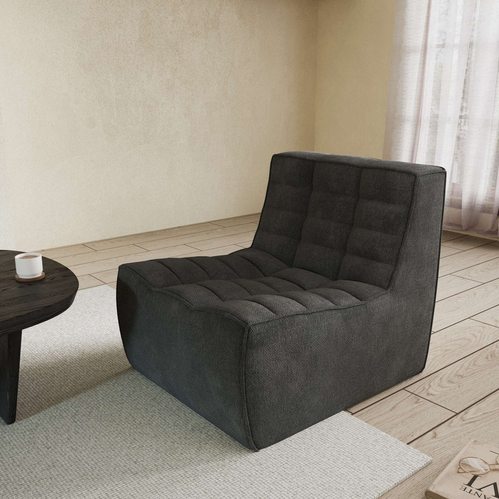 A black chenille accent chair with a minimalist design