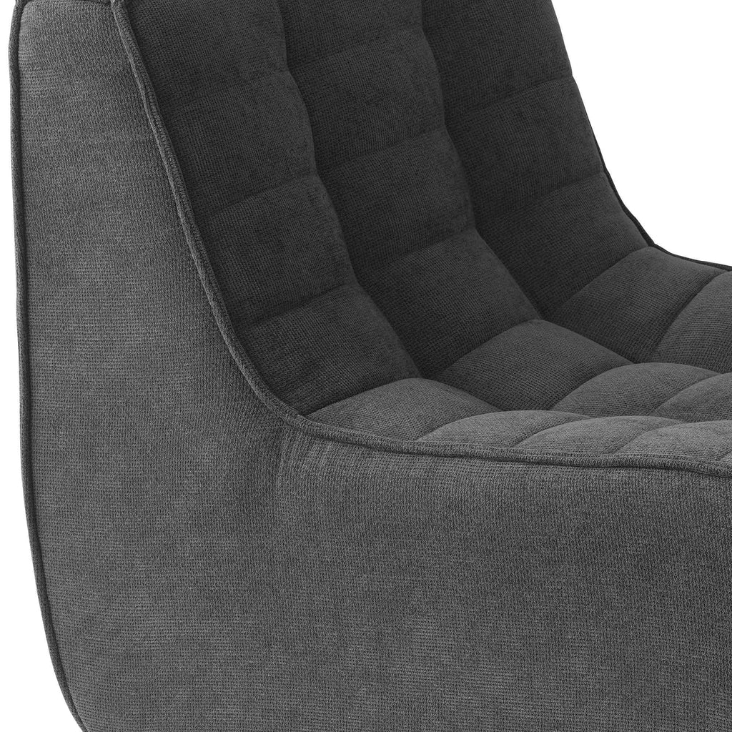 Close-up of a seat of a black waffle floor sofa